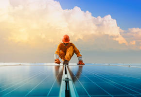 Man on solar panels